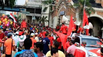 People wearing red gathered in Kuala Lumpur.